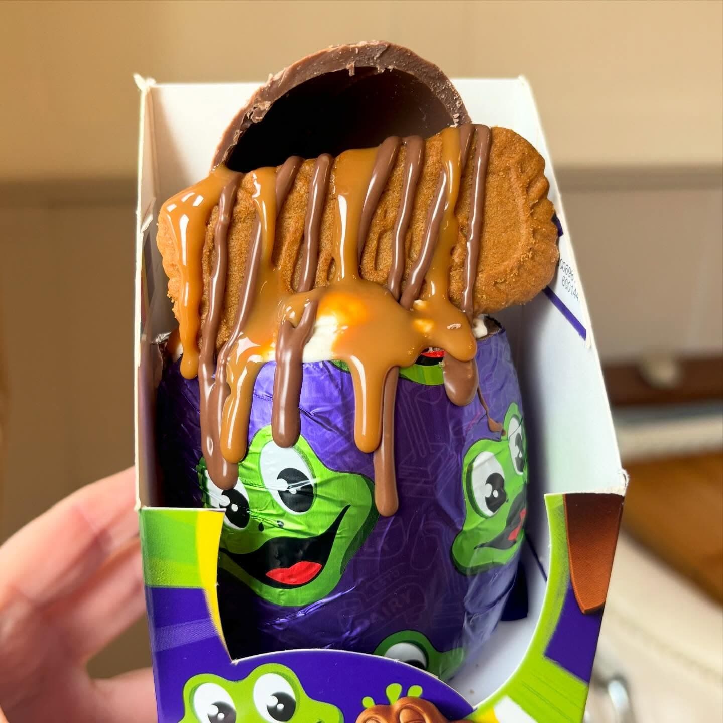 Filled Easter egg with caramel and Biscoff toppings