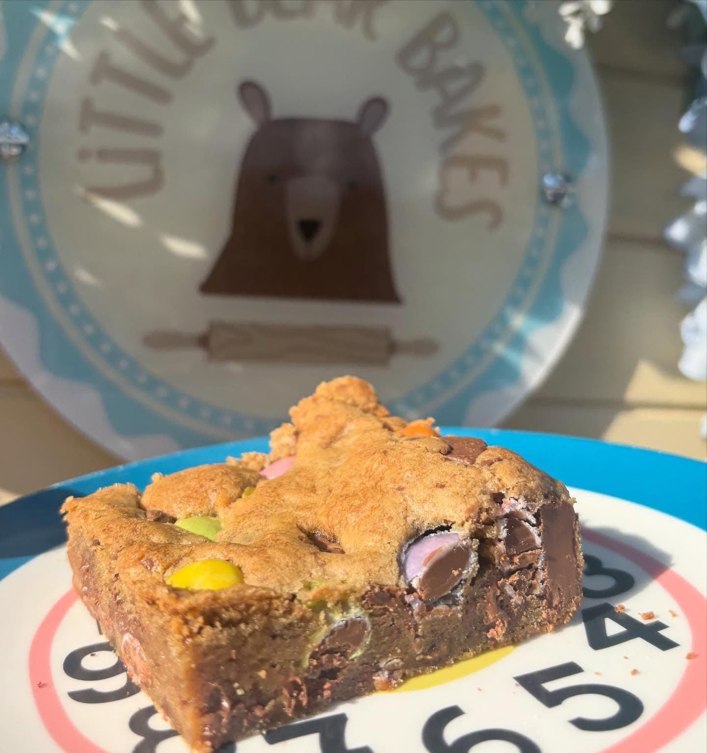 Smarties cookie bar slice with colourful chocolate pieces